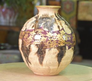 Japanese Pottery Vase decorated with a Wood Grain Design and Flowers