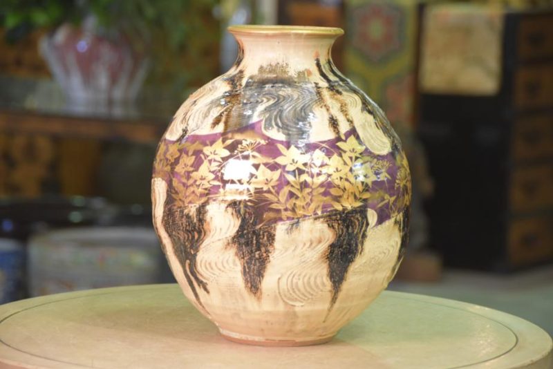 Japanese Pottery Vase decorated with a Wood Grain Design and Flowers