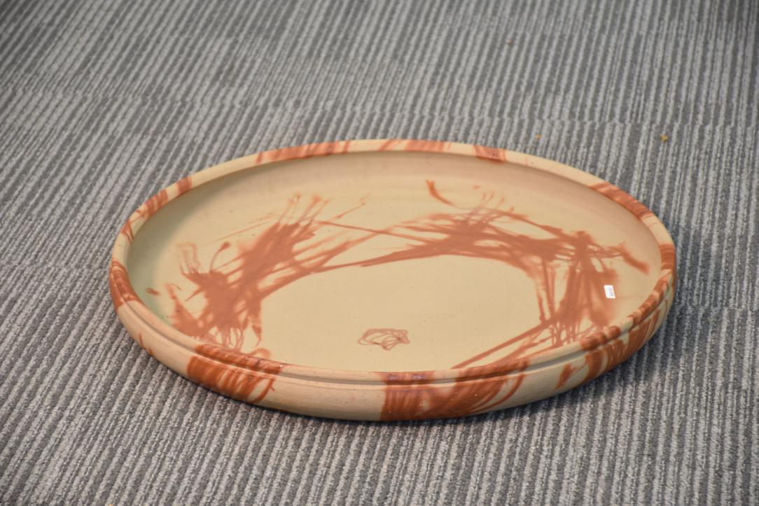A substantial Japanese Bizen pottery platter showcasing the earthy tones and natural firing effects that define this celebrated ceramic tradition. Handcrafted using centuries-old techniques, it features a rustic surface and organic textures. Both functional and decorative, this impressive piece reflects the timeless beauty and craftsmanship of Bizen ware.