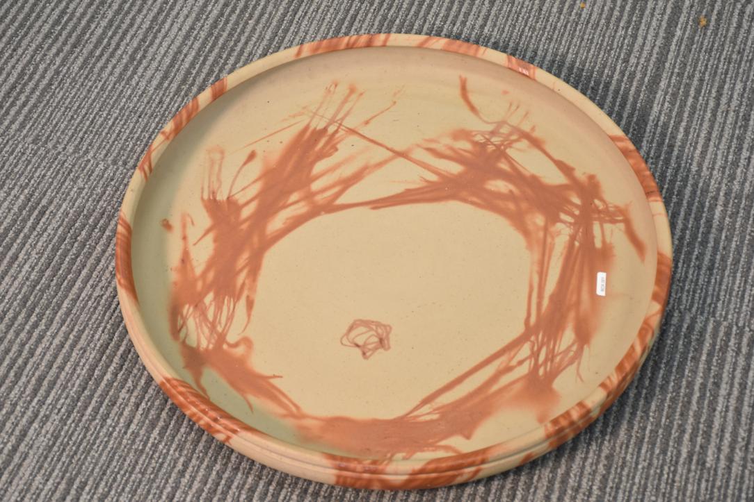 A substantial Japanese Bizen pottery platter showcasing the earthy tones and natural firing effects that define this celebrated ceramic tradition. Handcrafted using centuries-old techniques, it features a rustic surface and organic textures. Both functional and decorative, this impressive piece reflects the timeless beauty and craftsmanship of Bizen ware.